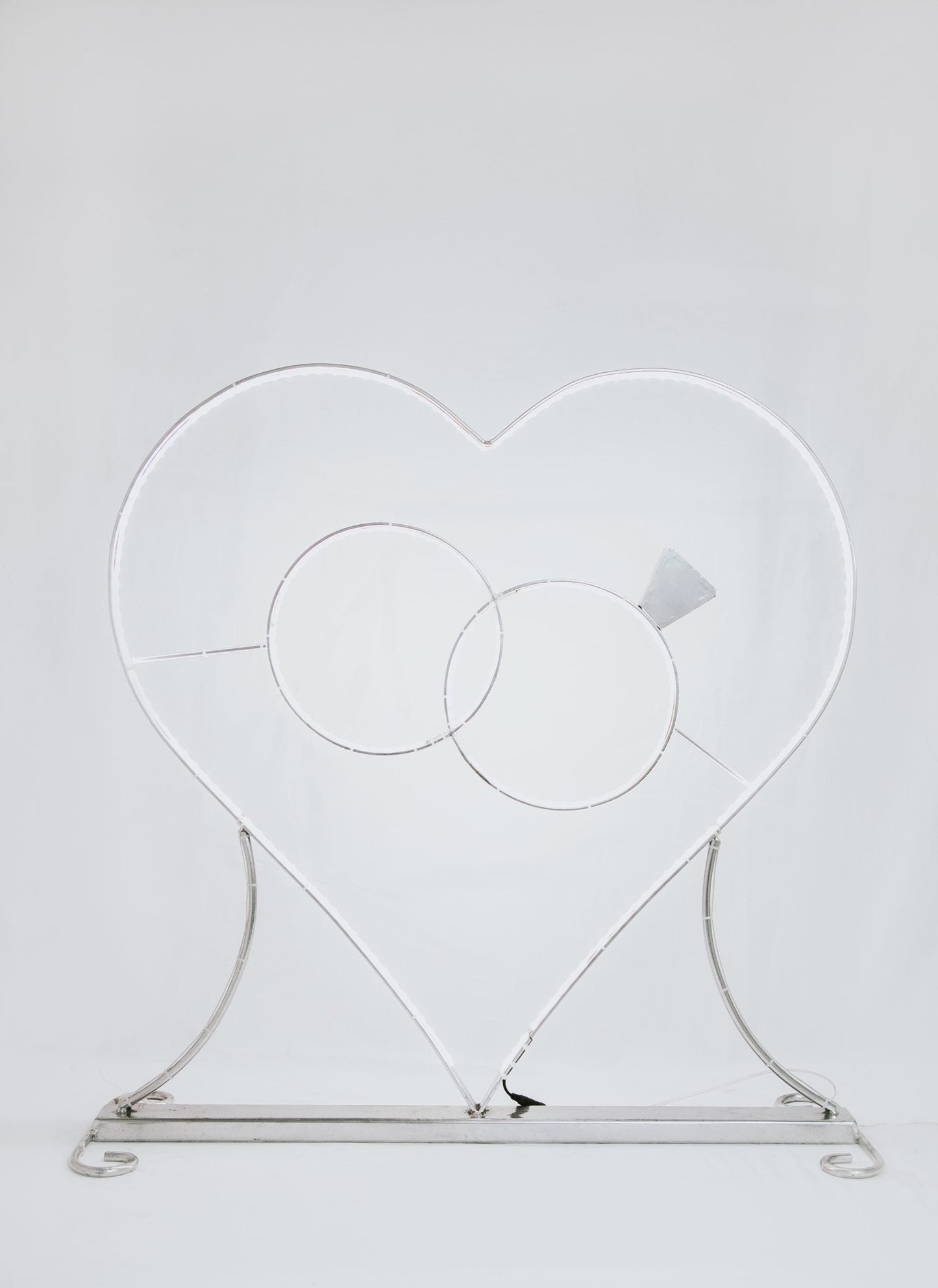 Fig. Heart with rings and light